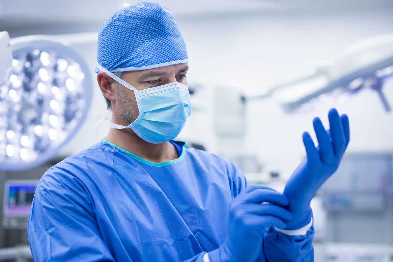 Professional surgeon in sterile surgical environment